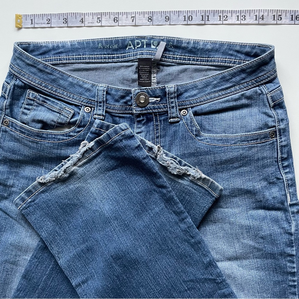 White stitched blue jeans